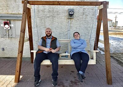 Couple seating on swing